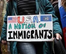 Sign reading "USA A Nation of Immigrants"
