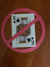 Playing card king crossed out